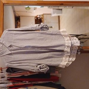 Long sleeved button up front shirt.